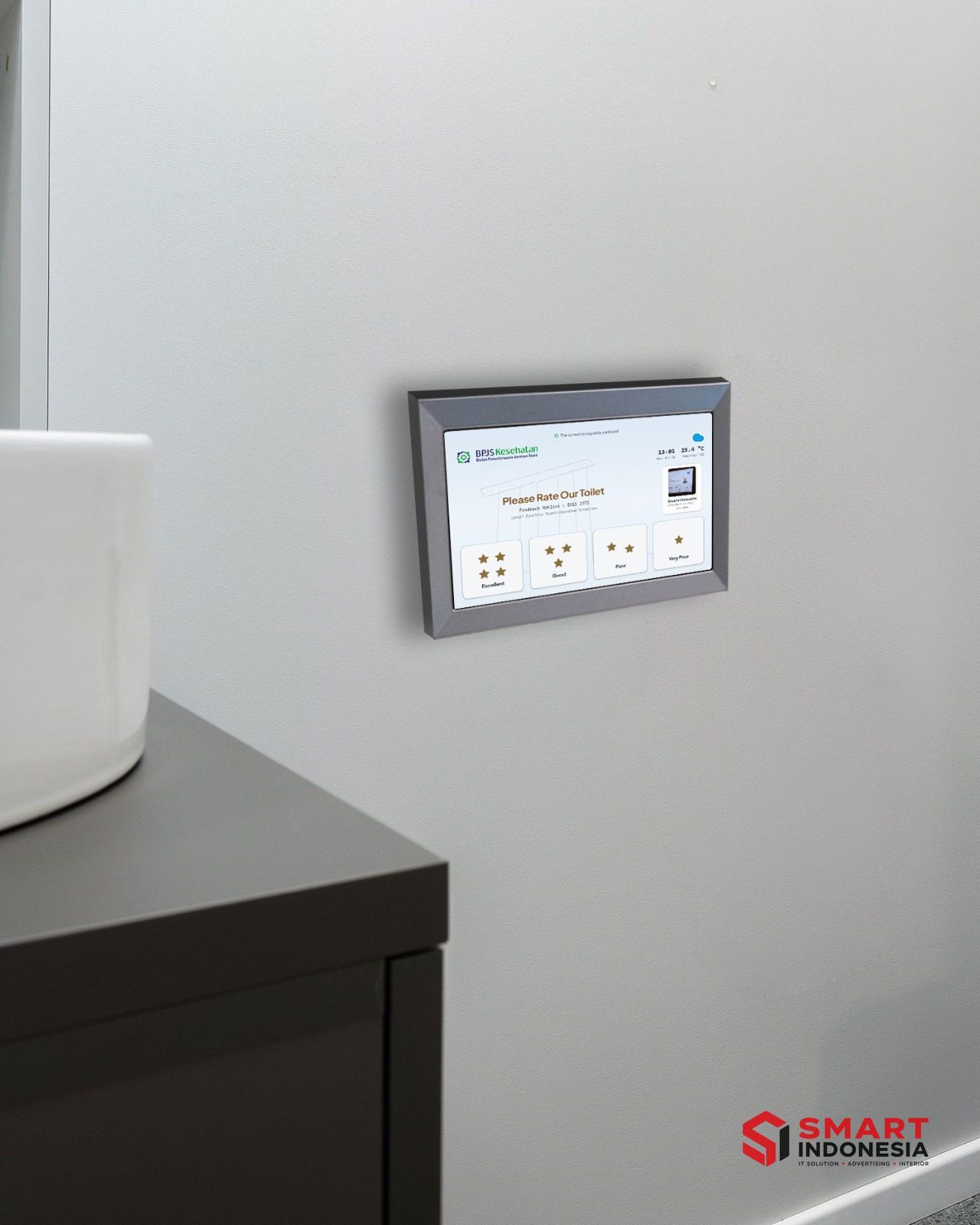 Instalasi SmartSanitasi — Unit tablet SmartSanitasi di area wastafel toilet — BPJS Kesehatan
